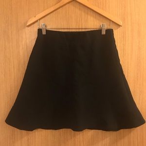 Black flippy midi skirt with angled stitching